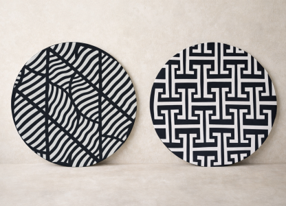 Traditional Imigongo artwork featuring geometric patterns in black, white, and earthy natural tones handcrafted in Rwanda
