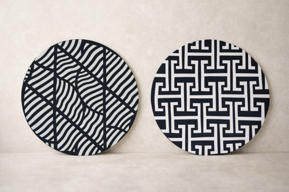 Traditional Imigongo artwork featuring geometric patterns in black, white, and earthy natural tones handcrafted in Rwanda